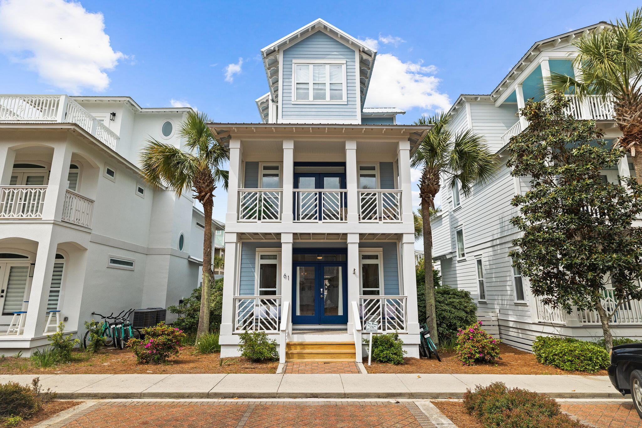 61 West Seacrest Beach Blvd Inlet Beach Inlet Beach, FL 32461 - Photo 17 of 47 a front view of a residential apartment building with a yard