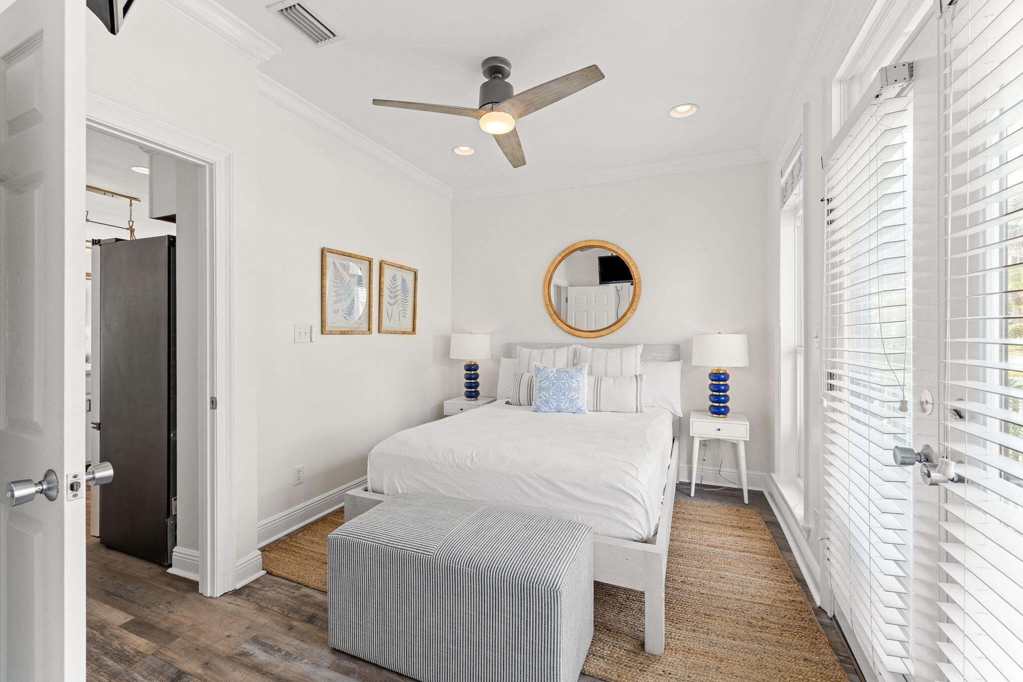 61 West Seacrest Beach Blvd Inlet Beach Inlet Beach, FL 32461 - Photo 25 of 47 a bedroom with a bed a window and a chandelier
