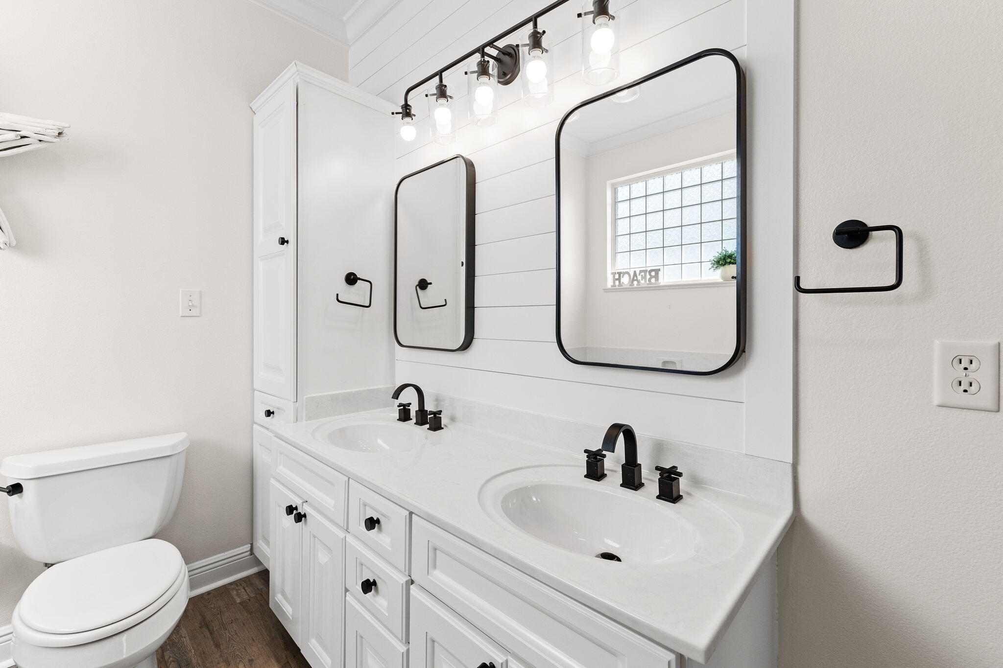 61 West Seacrest Beach Blvd Inlet Beach Inlet Beach, FL 32461 - Photo 32 of 47 a bathroom with a sink a toilet and a mirror
