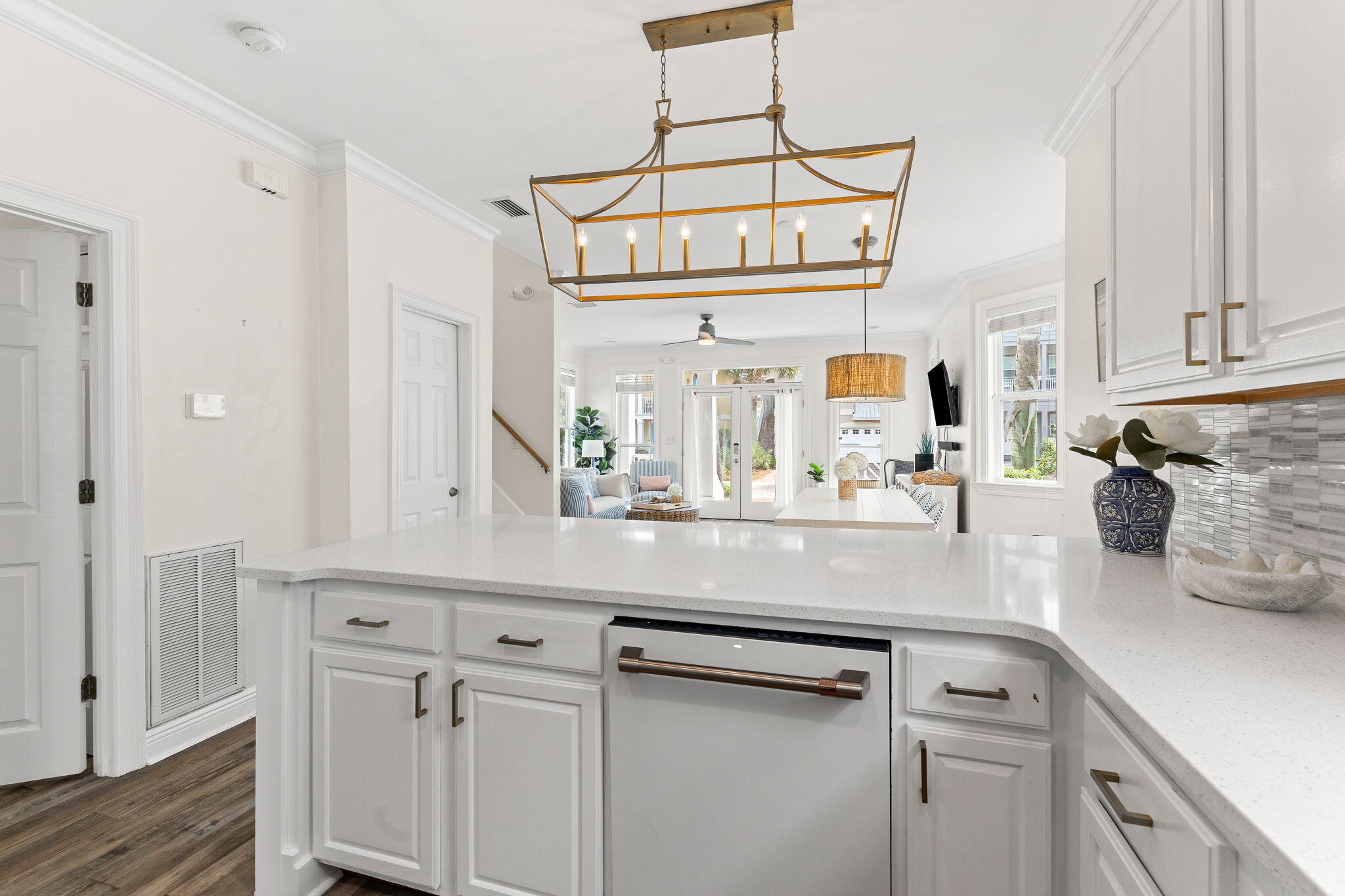61 West Seacrest Beach Blvd Inlet Beach Inlet Beach, FL 32461 - Photo 10 of 47 a kitchen with cabinets and chandelier
