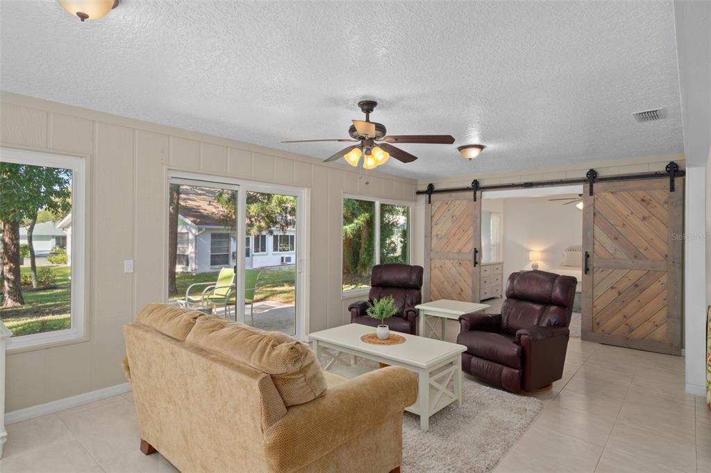 6147 Turnburry Court Spring Hill, FL 34606 - Photo 12 of 31 a living room with furniture and a window