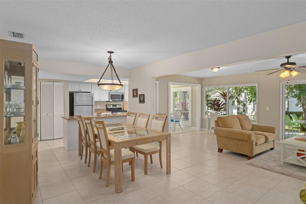 6147 Turnburry Court Spring Hill, FL 34606 - Photo 15 of 31 a view of a dining room with furniture window and outside view