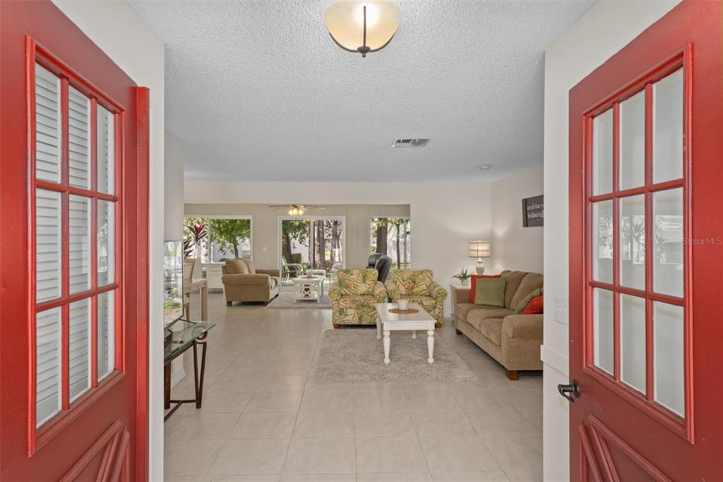 6147 Turnburry Court Spring Hill, FL 34606 - Photo 7 of 31 a living room with furniture and a window