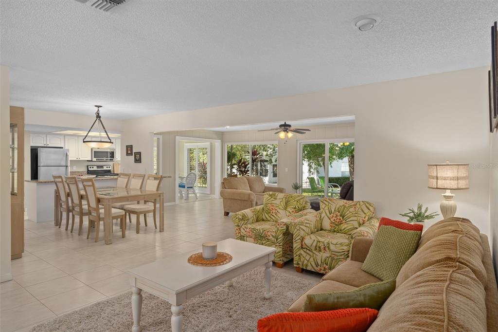 6147 Turnburry Court Spring Hill, FL 34606 - Photo 9 of 31 a living room with furniture and wooden floor