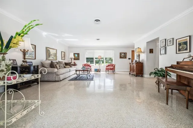 a living room with furniture and a table