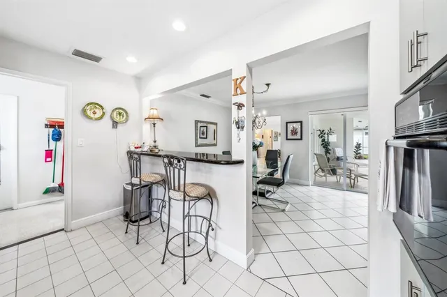 a view of a livingroom with furniture and a flat screen tv