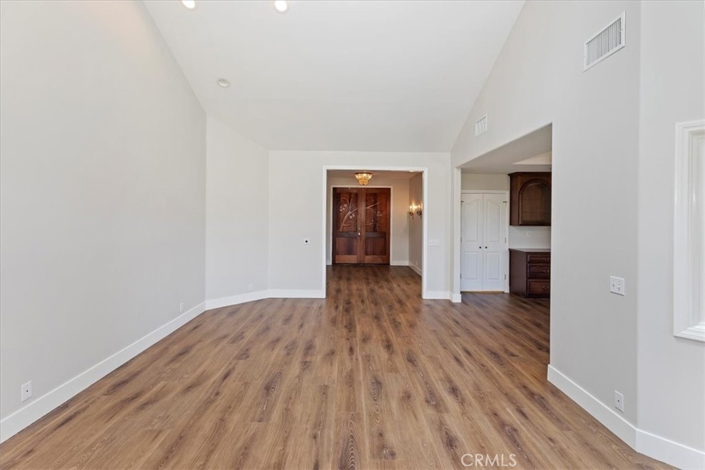 1507 Weston Way Riverside, CA 92506 - Photo 13 of 55 an empty room with wooden floor and closet