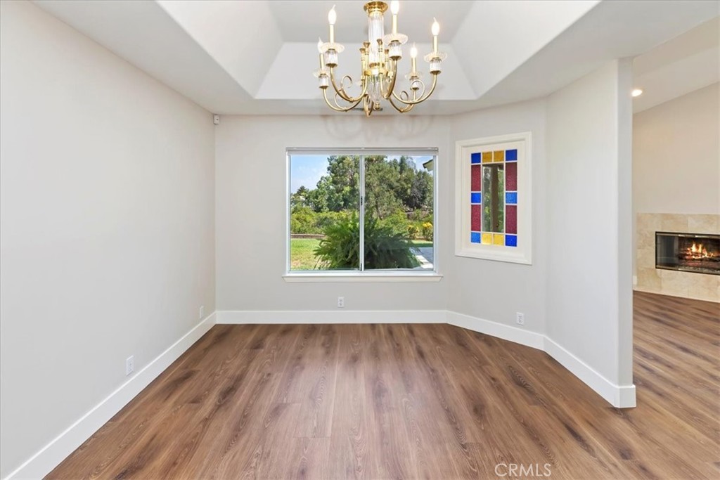 1507 Weston Way Riverside, CA 92506 - Photo 15 of 55 wooden floor in an empty room with a window