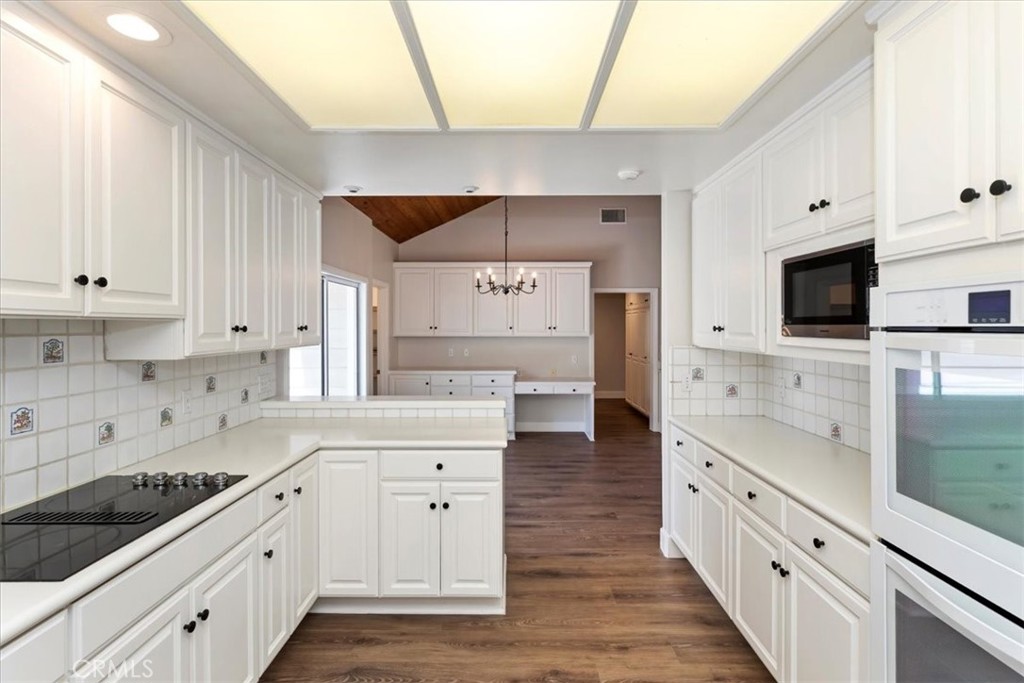 1507 Weston Way Riverside, CA 92506 - Photo 19 of 55 a kitchen with stainless steel appliances granite countertop a stove and a sink