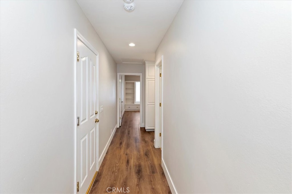 1507 Weston Way Riverside, CA 92506 - Photo 27 of 55 a view of a hallway with wooden floor