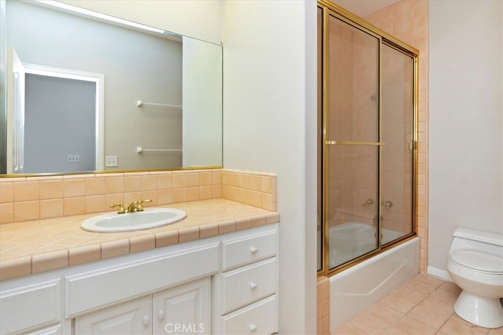 1507 Weston Way Riverside, CA 92506 - Photo 29 of 55 a bathroom with a granite countertop sink toilet and shower