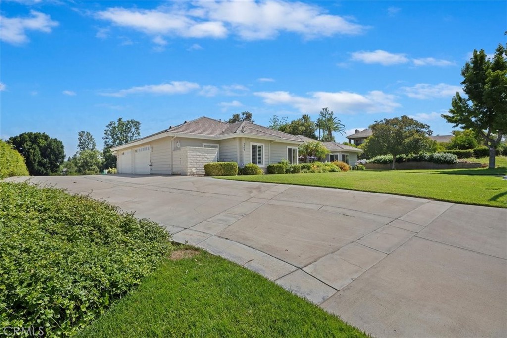 1507 Weston Way Riverside, CA 92506 - Photo 3 of 55 a front view of a house with a yard and trees