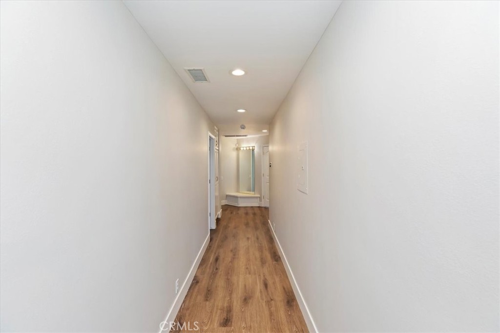 1507 Weston Way Riverside, CA 92506 - Photo 31 of 55 a view of a hallway with wooden floor