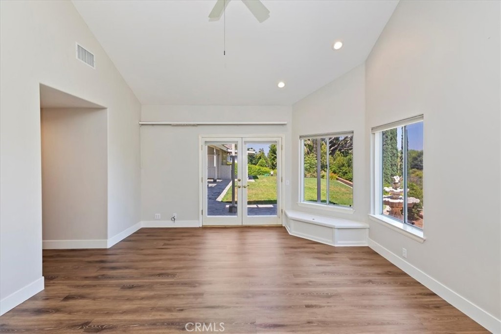 1507 Weston Way Riverside, CA 92506 - Photo 36 of 55 a view of an empty room with wooden floor and a window