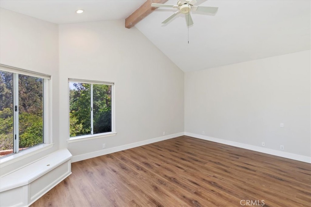 1507 Weston Way Riverside, CA 92506 - Photo 37 of 55 a view of an empty room with wooden floor and a window