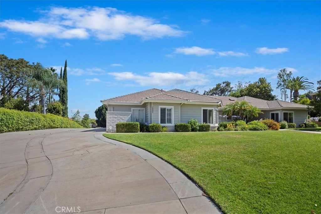 1507 Weston Way Riverside, CA 92506 - Photo 5 of 55 a front view of a house with a yard