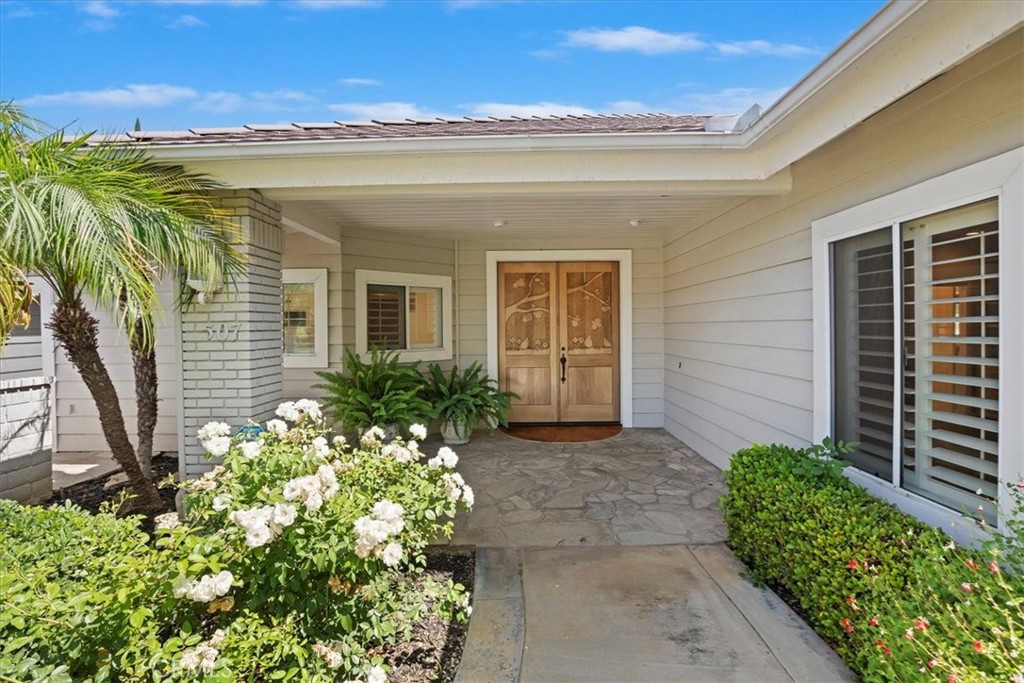 1507 Weston Way Riverside, CA 92506 - Photo 7 of 55 a view of a house with a flower garden