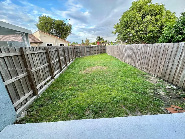 a view of a garden from a balcony