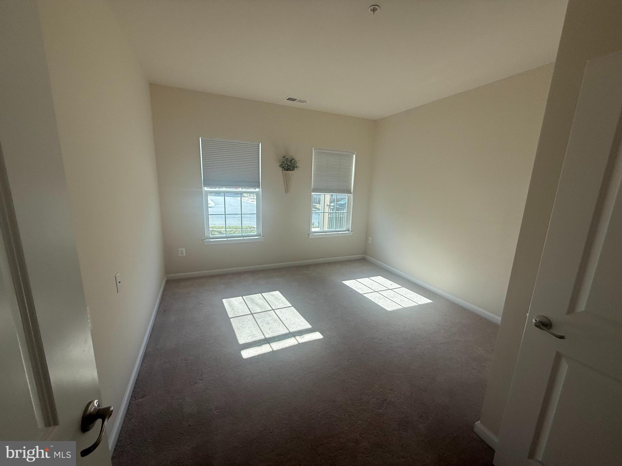 8470 Ice Crystal Drive, Unit B Laurel, MD 20723 - Photo 9 of 14 a view of empty room with windows