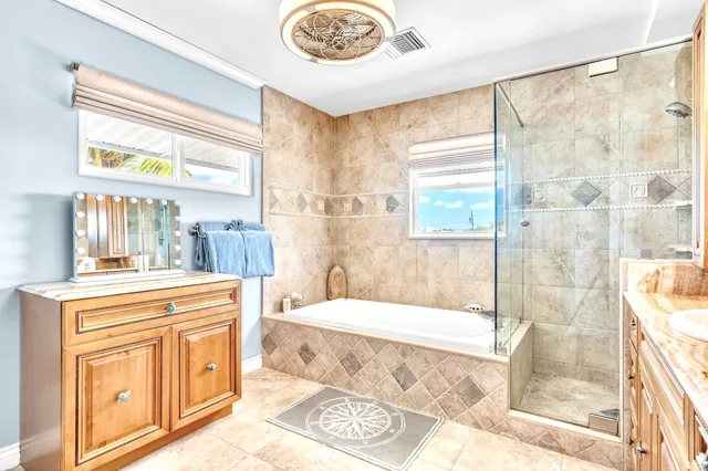 a bathroom with a sink a bathtub and a shower