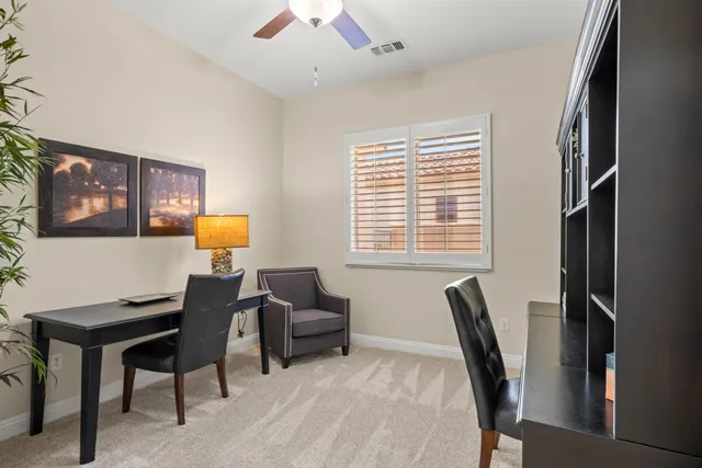 a view of a livingroom with furniture and a window