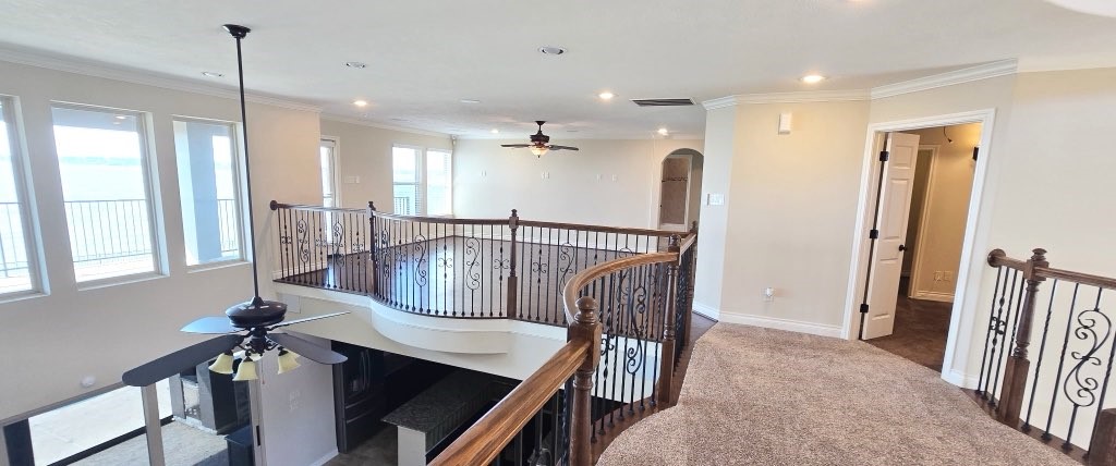 127 Bridgewater Onalaska, TX 77360 - Photo 23 of 34 a view of a hallway with furniture and windows