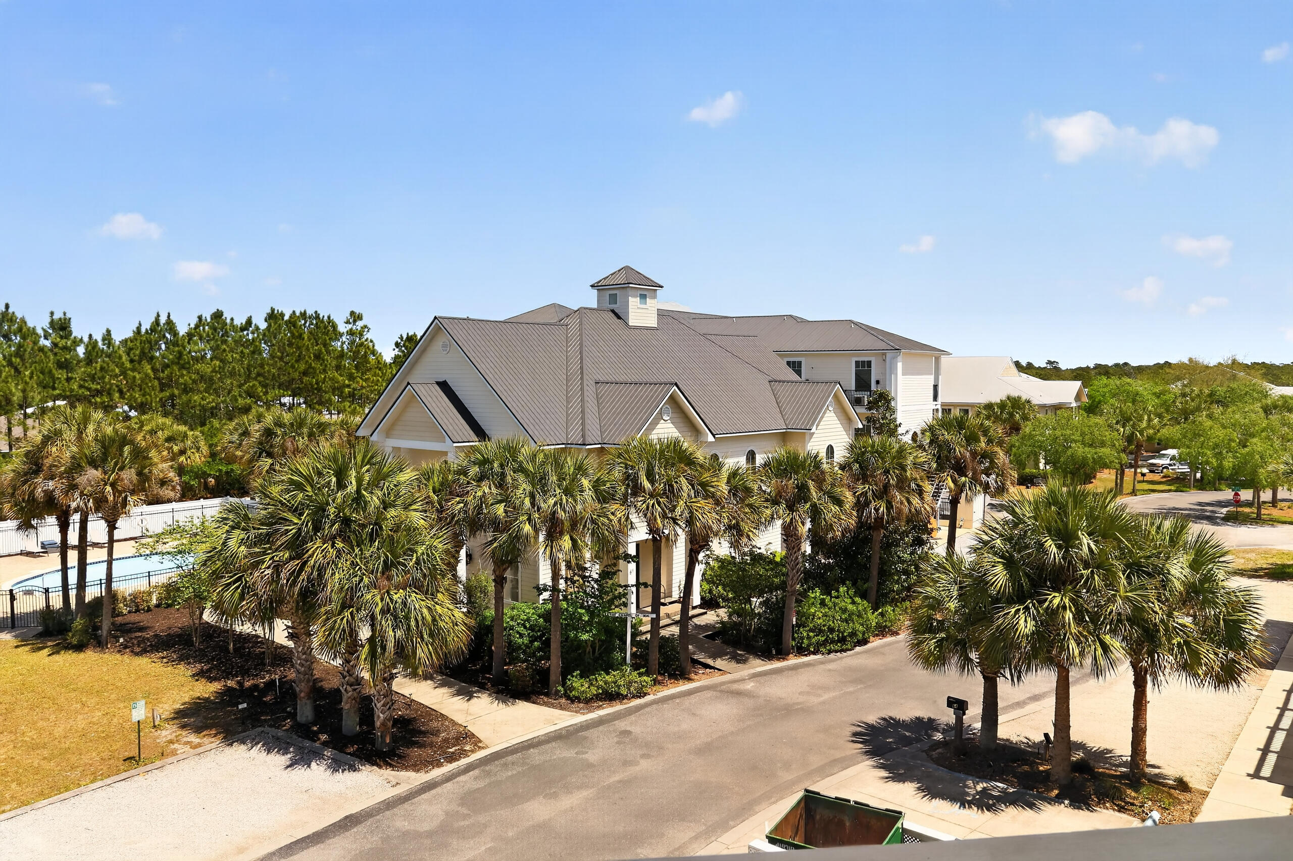 6904 West County Highway 30A, Unit MULTIPLE Santa Rosa Beach, FL 32459 - Photo 11 of 16 a front view of a house with a yard and tree s