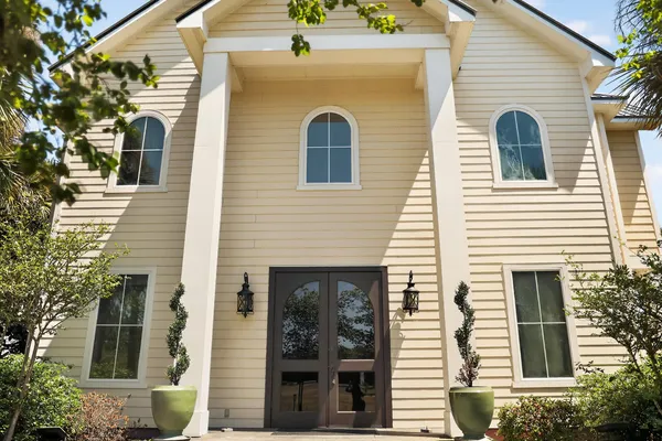 a front view of a house with glass windows
