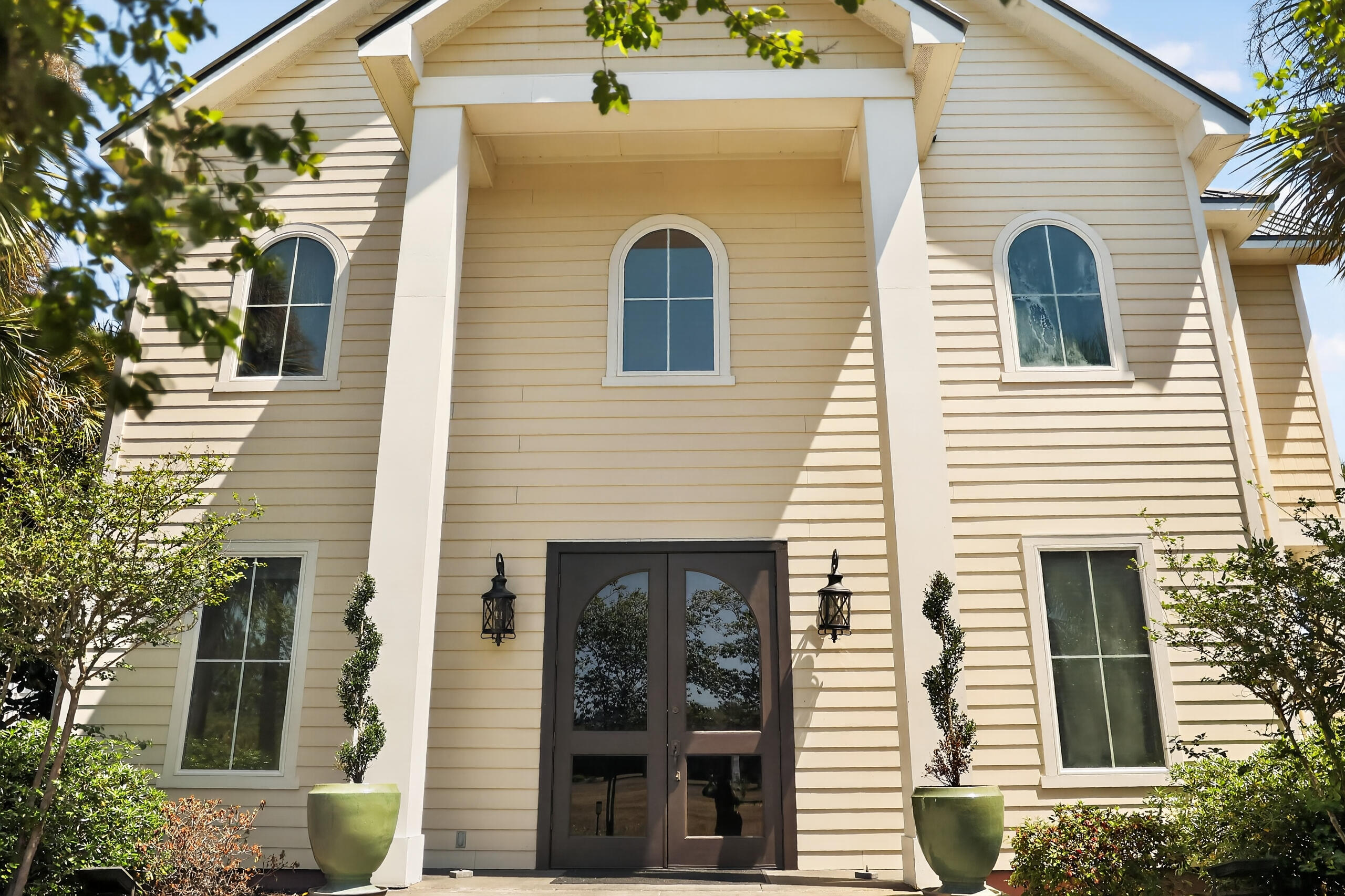 6904 West County Highway 30A, Unit MULTIPLE Santa Rosa Beach, FL 32459 - Photo 13 of 16 a front view of a house with glass windows