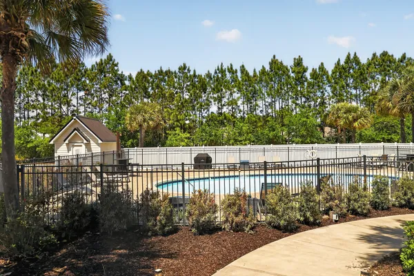 a view of a wrought iron fences in front of house