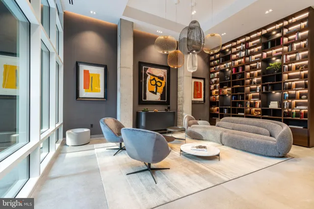 a view of staircase with a rug and a window