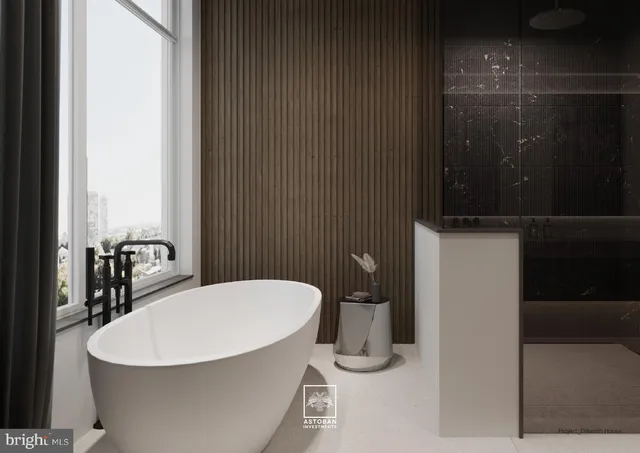 a large kitchen with stainless steel appliances a large counter top