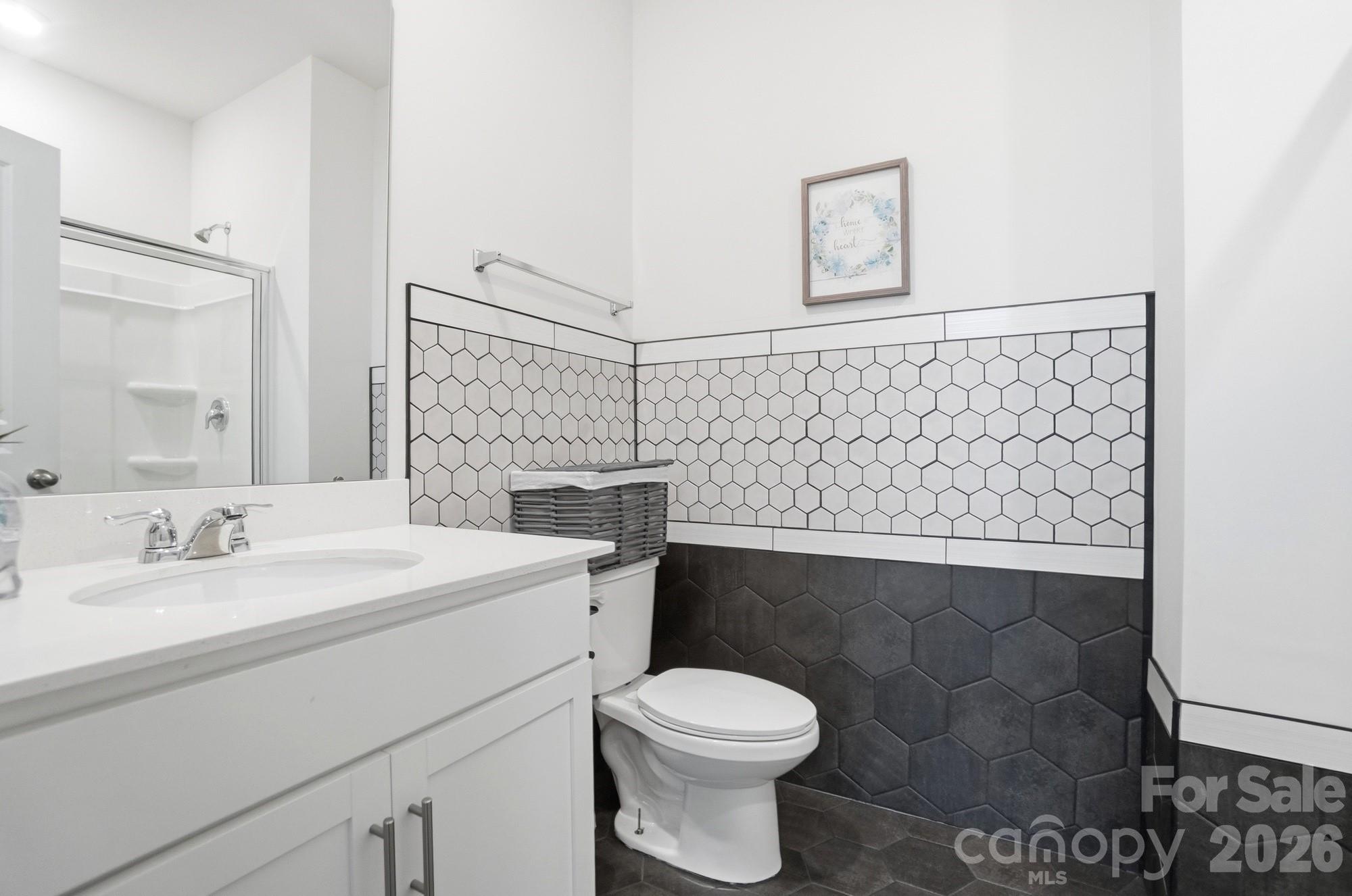 116 Timbergreen Court Troutman, NC 28166 - Photo 20 of 43 a bathroom with a sink toilet and vanity