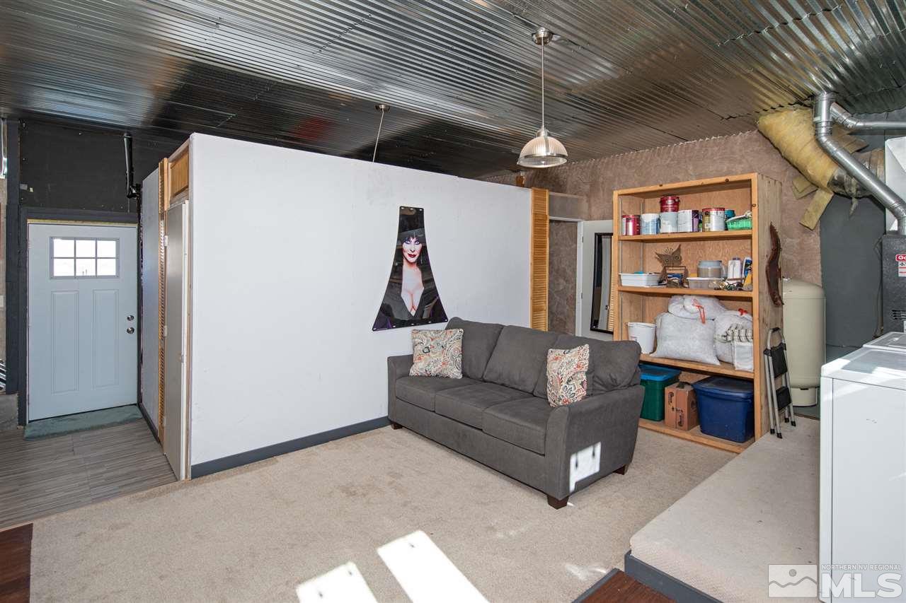 5805 Grass Valley Road Reno, NV 89510 - Photo 19 of 19 a living room with furniture a ceiling fan and a window