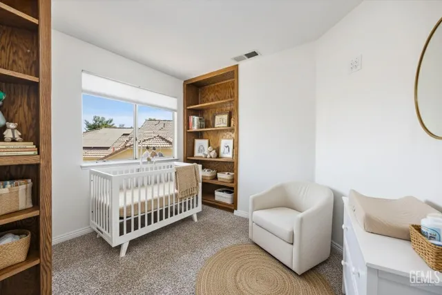 a view of room with window and cabinet