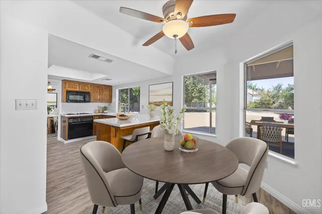 a view of a dining room with furniture window and outside view