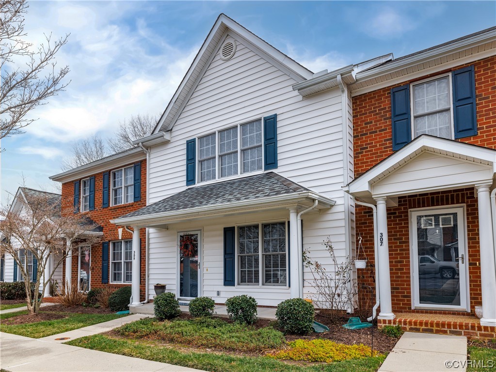 front view of a house with a yard