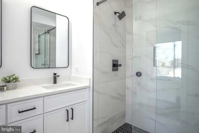 a bathroom with a sink a vanity and a mirror