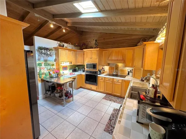 a dining room filled with furniture and window