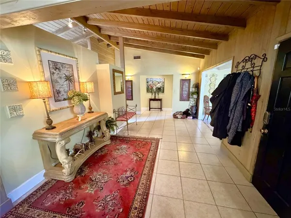 a living room with furniture a window and a table