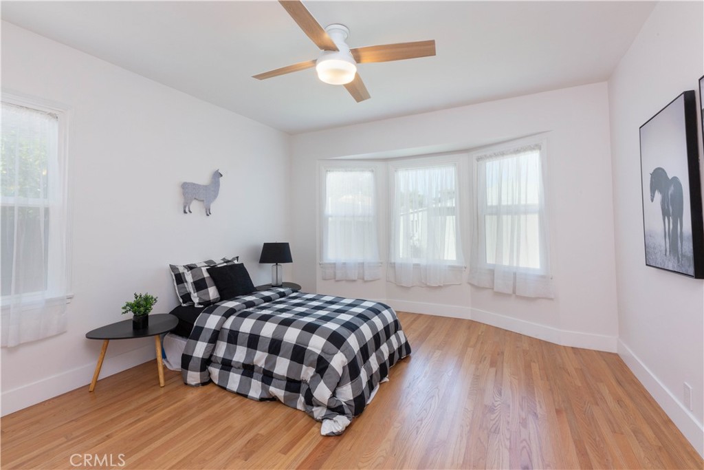 4907 East Arbor Road Long Beach, CA 90808 - Photo 27 of 47 Bedroom 3 is also super spacious, look at all that natural light and beautiful floors