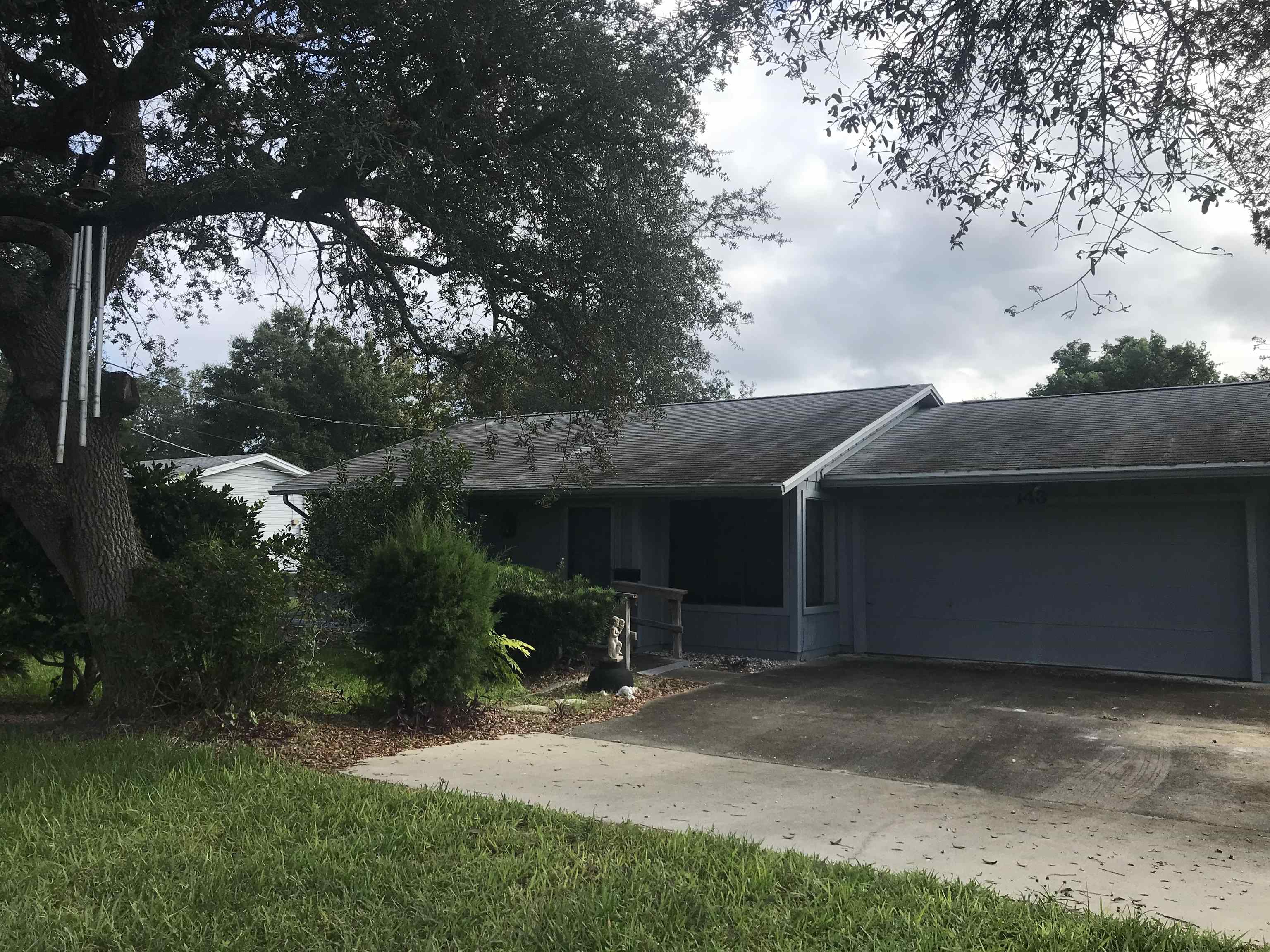 143 Jasmine Road St. Augustine, FL 32086 - Photo 3 of 3 a backyard of a house with table and chairs