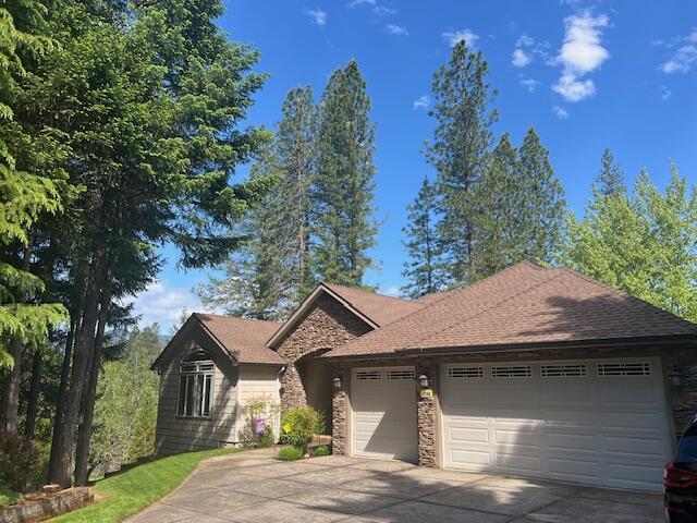 1280 Marcy Loop Road Grants Pass, OR 97527 - Photo 1 of 25 a front view of a house with a yard and garage