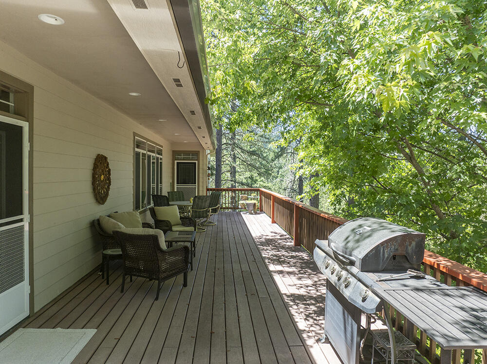 1280 Marcy Loop Road Grants Pass, OR 97527 - Photo 18 of 25 a view of deck with table and chairs and wooden floor