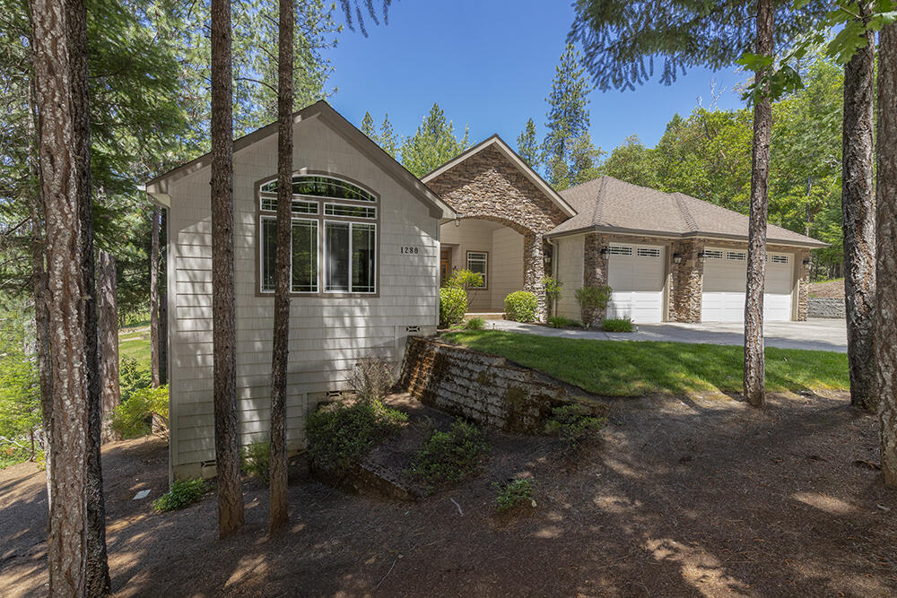 1280 Marcy Loop Road Grants Pass, OR 97527 - Photo 19 of 25 a front view of a house with garden
