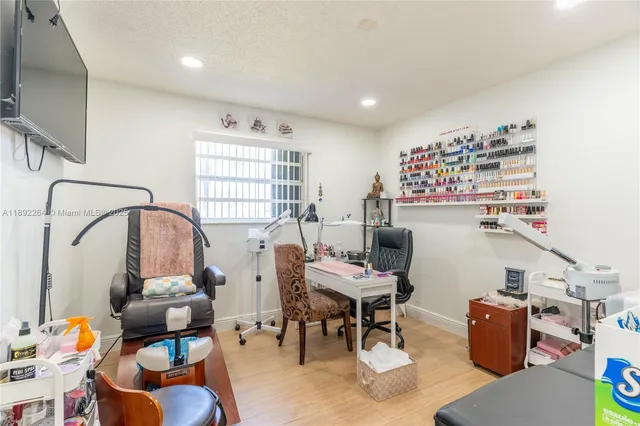 a living room with furniture and a floor to ceiling window