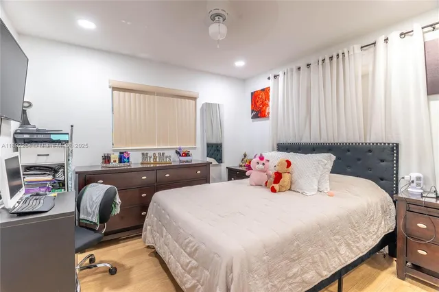 a bedroom with bed and a couch