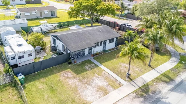 a view of an swimming pool with a yard