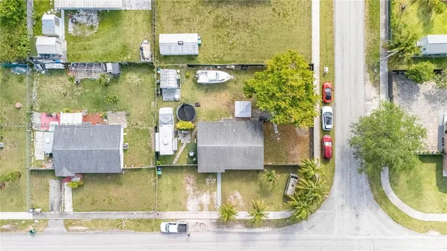 an aerial view of residential houses with outdoor space