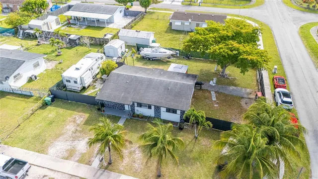 an aerial view of a house with swimming pool